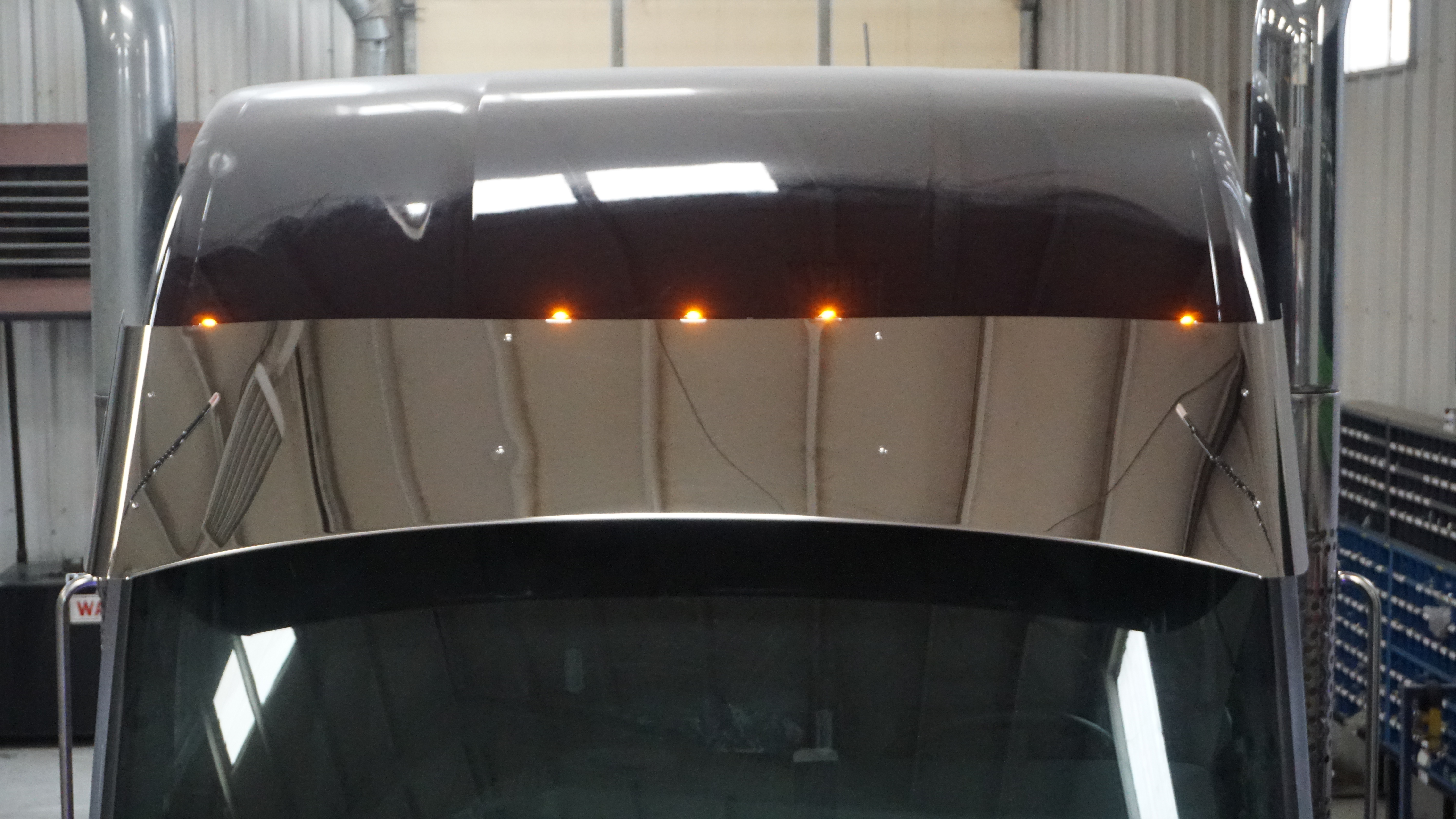 Kenworth W990 lighted visor in fab shop Custom light integrated visor for Kenworth W990 model in fab shop