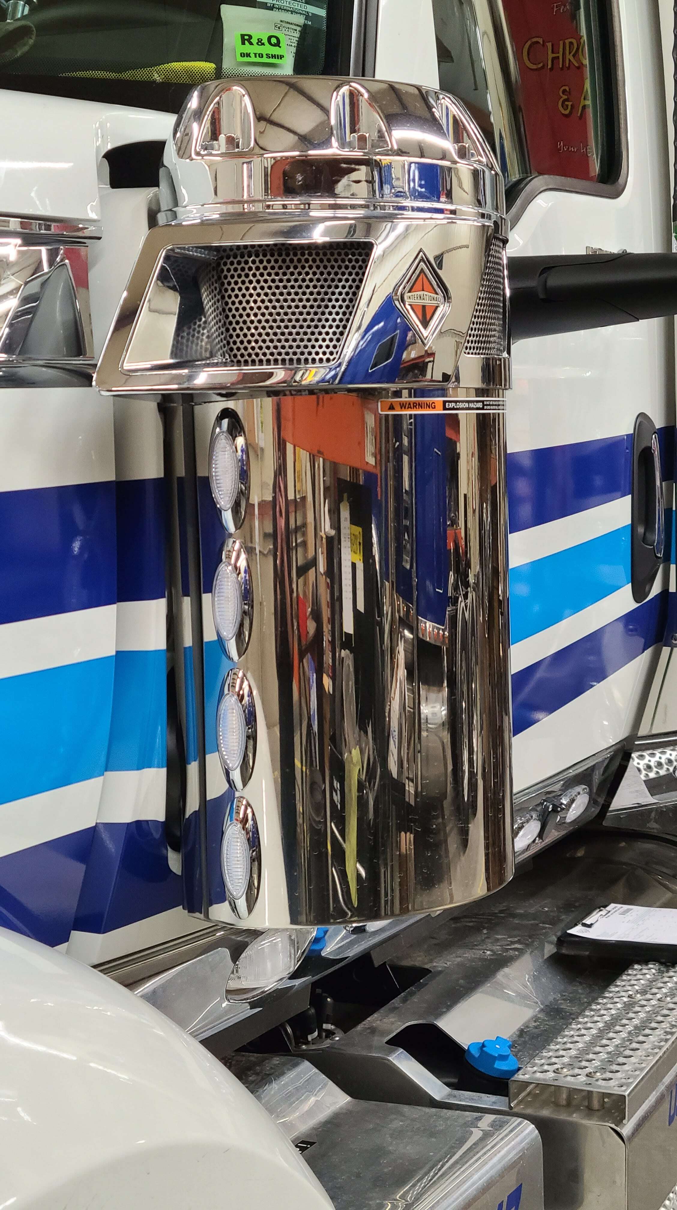 Custom CNC stainless steel air breather panel on workbench