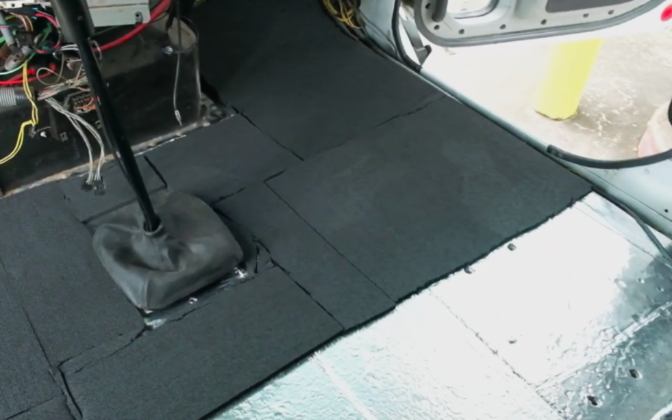 Hushmat foam installation on semi truck floor frame