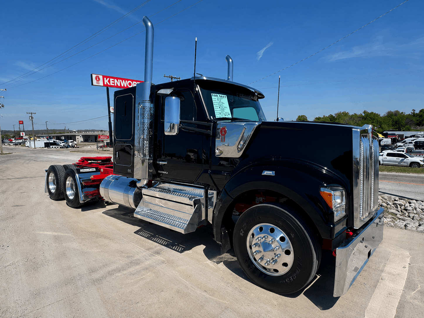 Red Kenworth W990 with aftermarket stainless visor