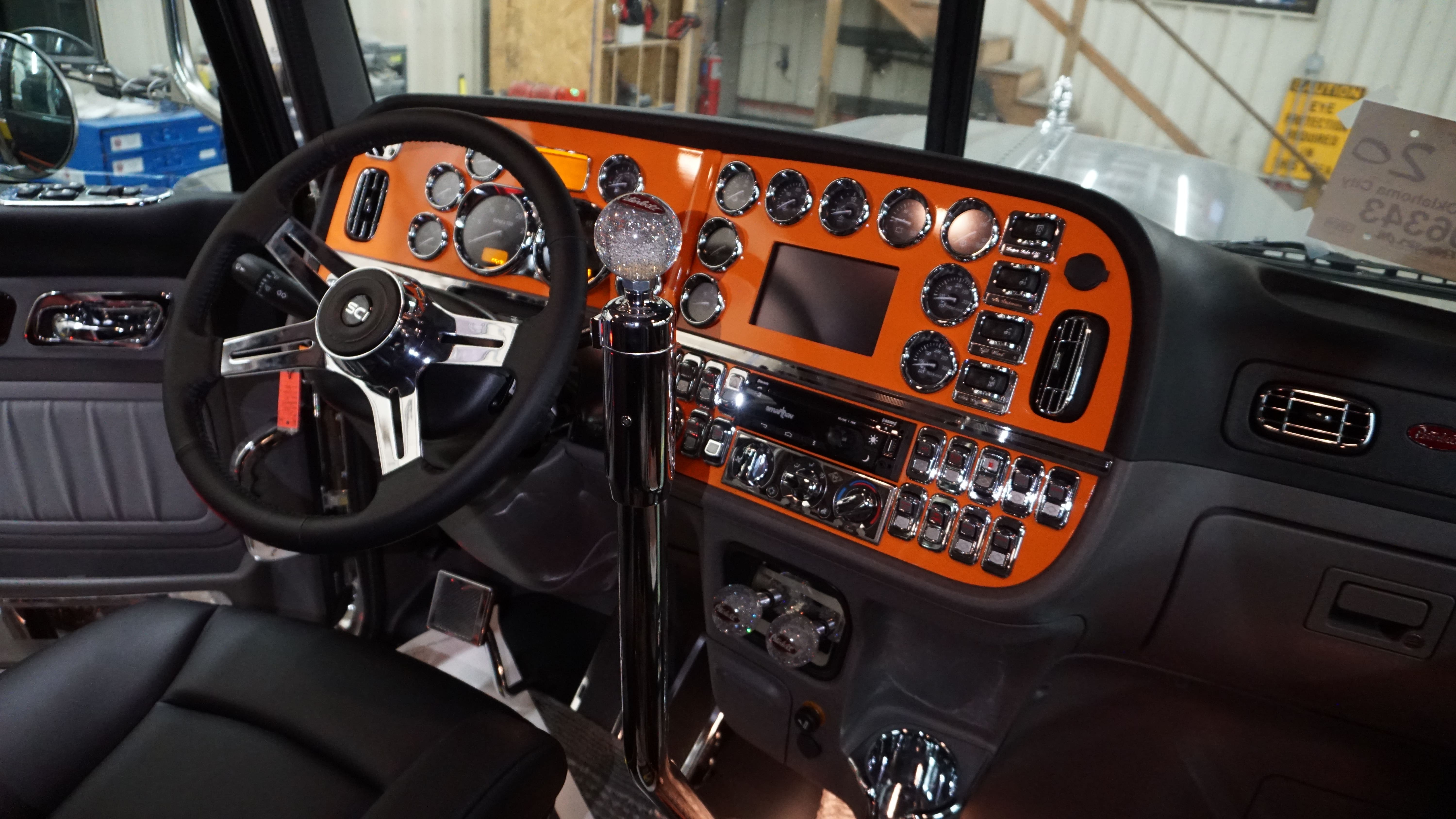 Peterbilt interior dashboard custom upgrades Orange-colored interior dashboard finish for Peterbilt